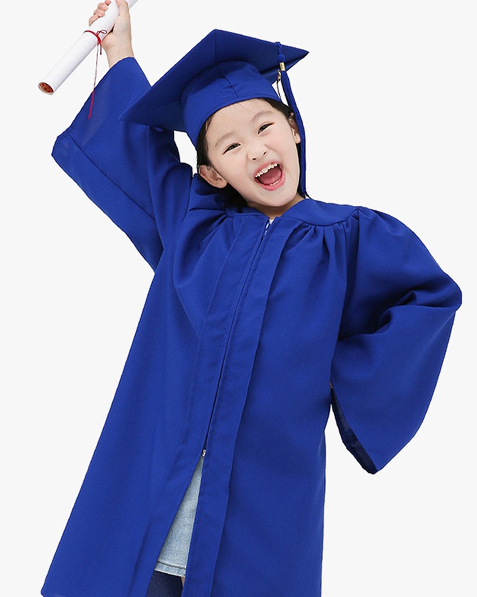 Children in Ravenhall have donned caps and gowns as they graduate from  kindergarten | Herald Sun